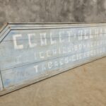 Antique advertising board billboard from Belgian store XXL