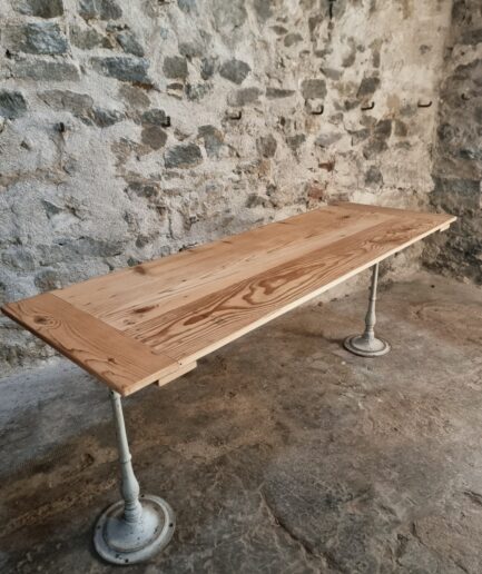 Antique French bistro table with pine top and cast iron base