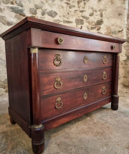 Antique mahogany commode with four drawers and brass mounts