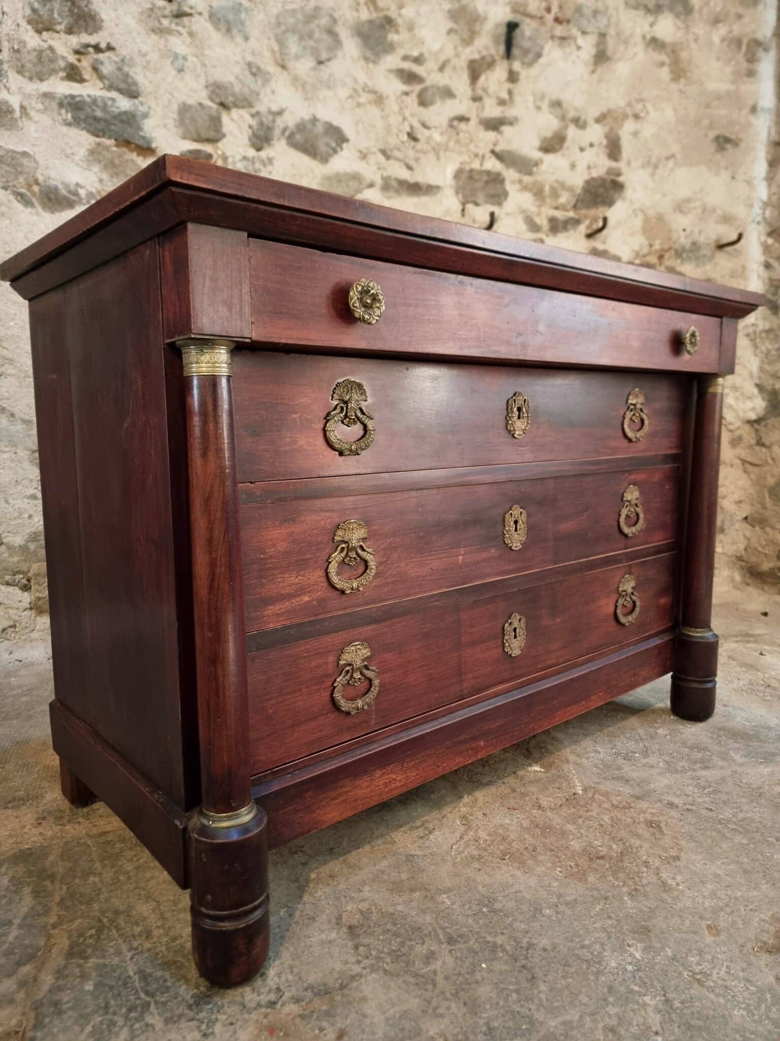 Antique French Empire Commode (Chest of Drawers) in Mahogany (1) Antique mahogany commode with four drawers and brass mounts