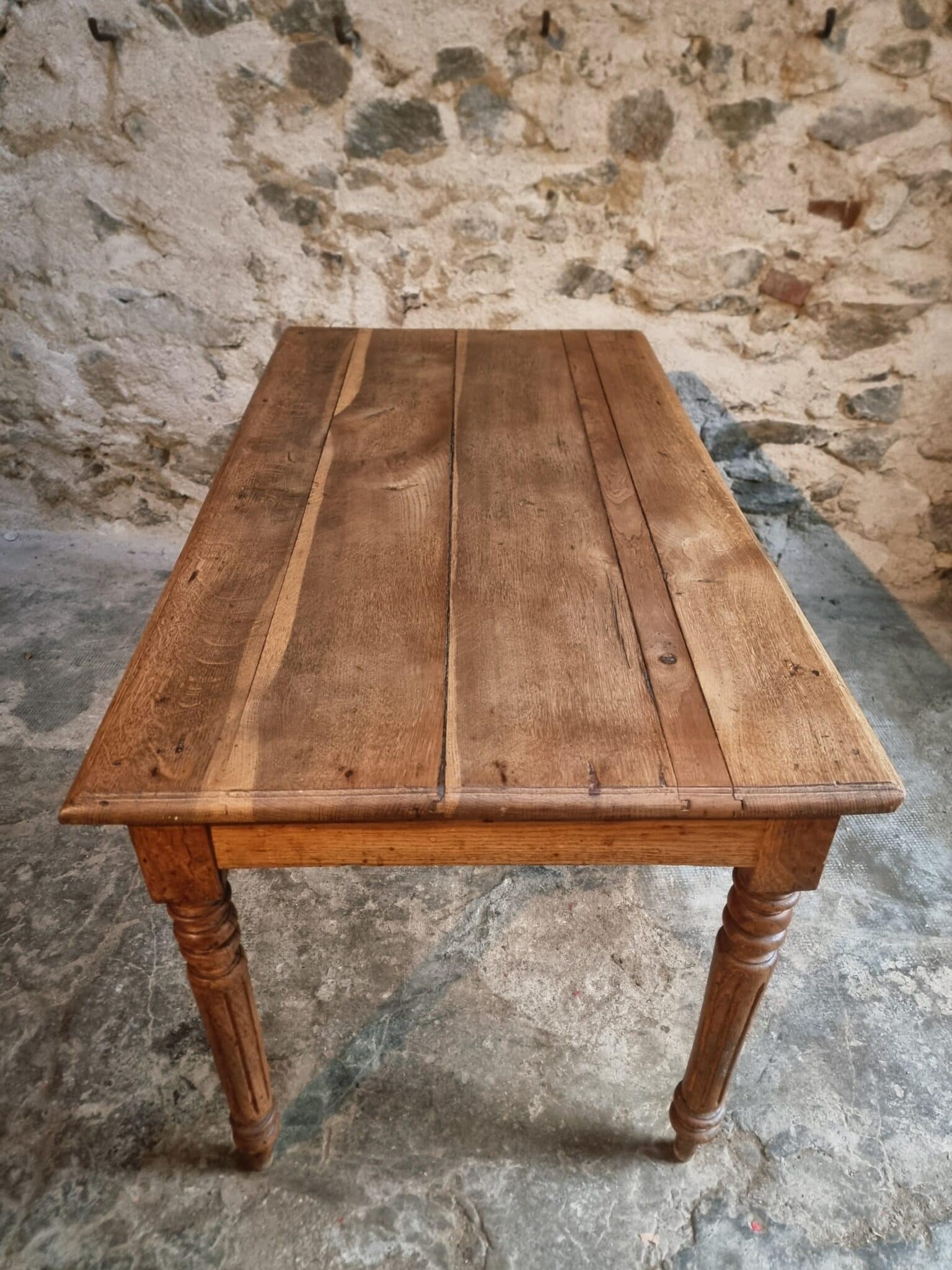 Antique French Oak Table with Drawers, Circa 1900 (2) solid oak tabletop with visible patina and wear marks