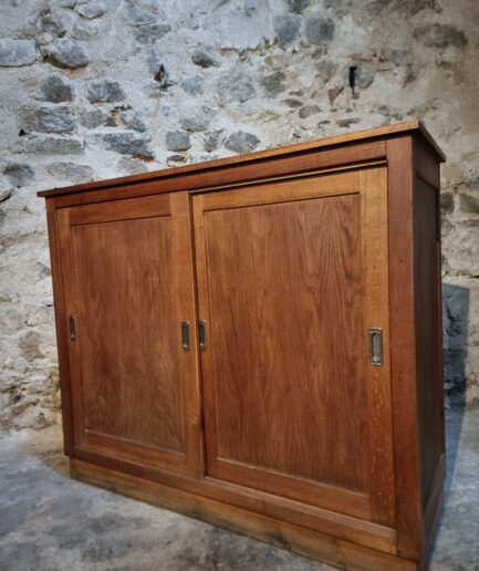 Oak cabinet with sliding doors closed